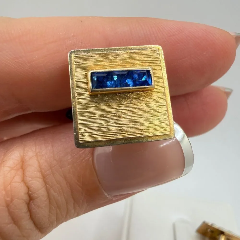 Vintage Krementz Gold tone cuff likes with princess cut blue rhinestone accents!